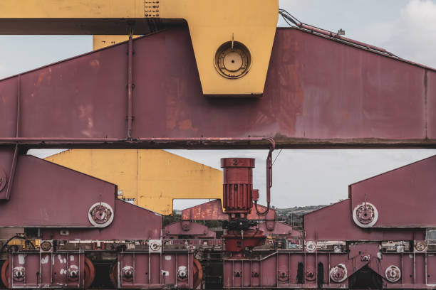 Detail of steel girders, wheels and lower assembly of a large shipyard crane at the Belfast (Northern Ireland) shipyard.  Harland and Wolff was established in 1861.  Its shipyard in Belfast produced the Titanic, among other ships.  Currently it employs less than 150 employees and specialises in marine repair and the assembly of off-shore wind farms.