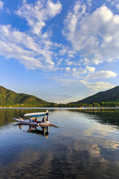 Scenic view of Dal lake, Jammu & Kashmir, India unidentified tourists enjoying boating at Dal Lake, Sri Nagar, Jammu & Kashmir, India on june 22, 2018 lake nagin stock pictures, royalty-free photos & images