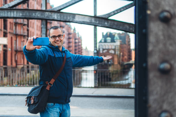 istock Man making selfie in Hamburg old town 1167704319