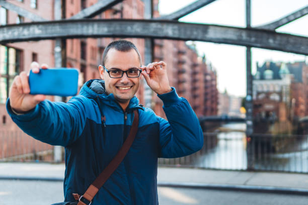 istock Man making selfie in Hamburg old town 1167704328
