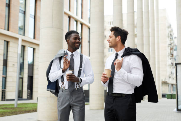 istock Business people drinking coffee outdoors 1167705991