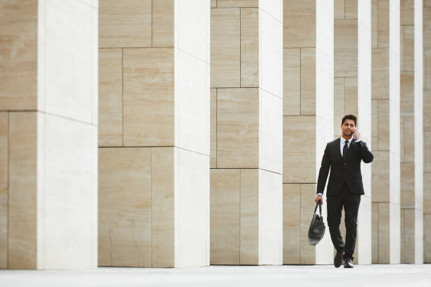 istock Busy businessman talking on the phone 1167706093