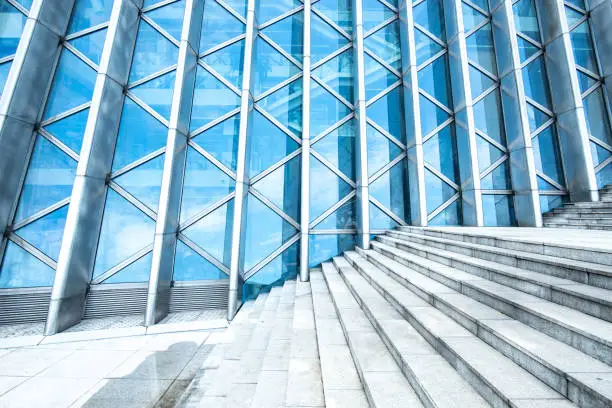 background of modern building, wall reflection with blue sky