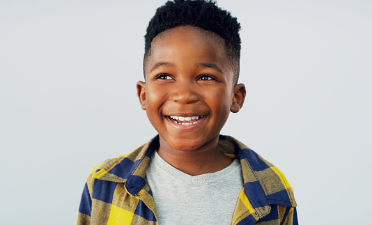 Shot of an adorable little boy posing against a white background