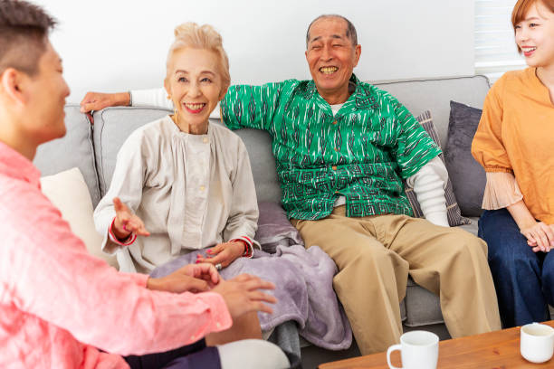 istock Adult Family Sitting Together Talking at Home 1167717708