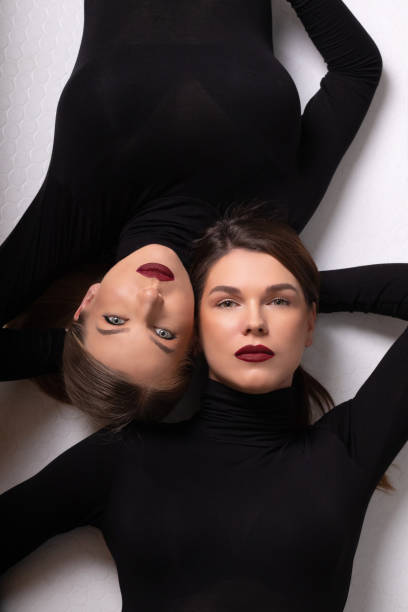 Portraits: Two Fashion Models Posing at the photo studio Two models posing in a studio, London, August 2019 london fashion stock pictures, royalty-free photos & images