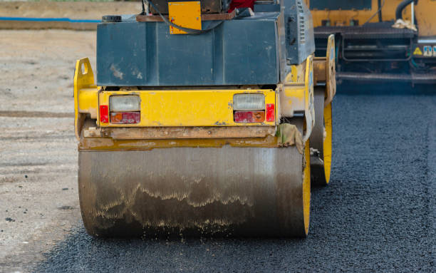 istock Worker leads the vibrating road roller to compact the asphalt laid out for the construction of a road 1167719058