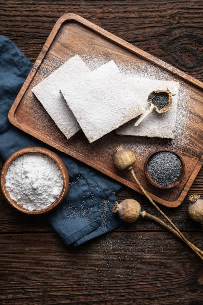 Poppy seed bars with potato dough and topped with sugar on a stone background