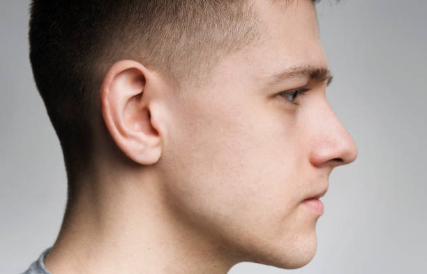 istock Serious millennial caucasian guy side view portrait 1167721234