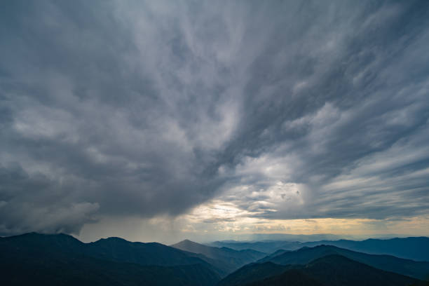 istock The beautiful mountain landscape on the rainy cloud background 1167722873