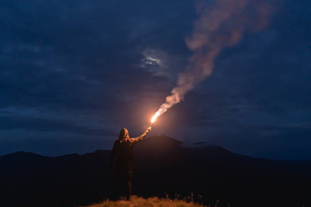 istock The man with a firework stick standing on a mountain 1167722890
