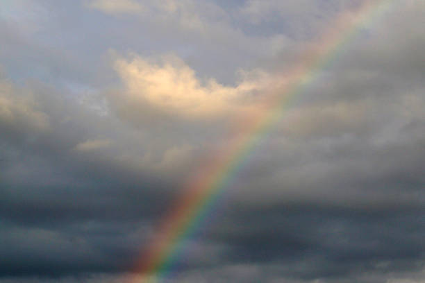 istock Beautiful rainbow on a cloudy sky after rain. 1167723022