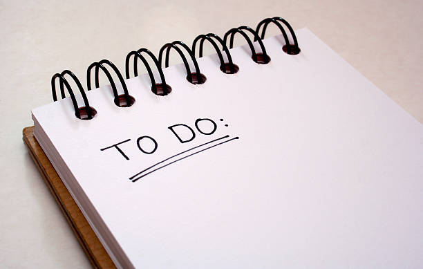 Notepad - to do list - get things done A note pad with 'to do' hand written on it. to do list stock pictures, royalty-free photos & images