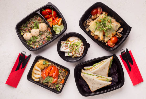 istock Healthy Food with fresh vegetables in black boxes to go 1167724111