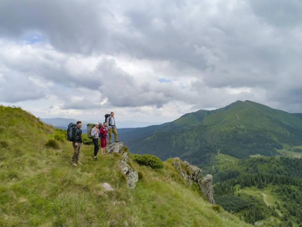 istock The four people standing on the picturesque mountain 1167724321