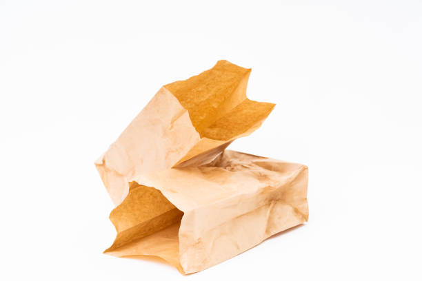 istock Crumpled brown paper bag on white background 1167724335