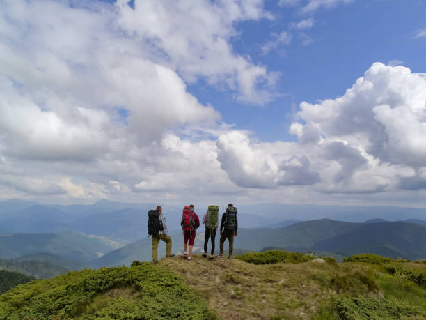 istock The four active people standing on the picturesque mountain 1167724443