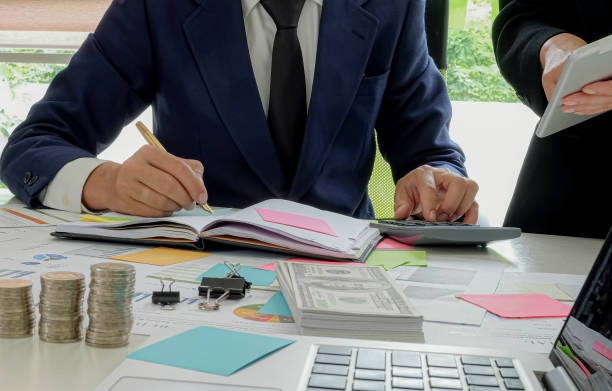 istock Business finance concept, Businessmen are using calculator and taking notes. 1167725380
