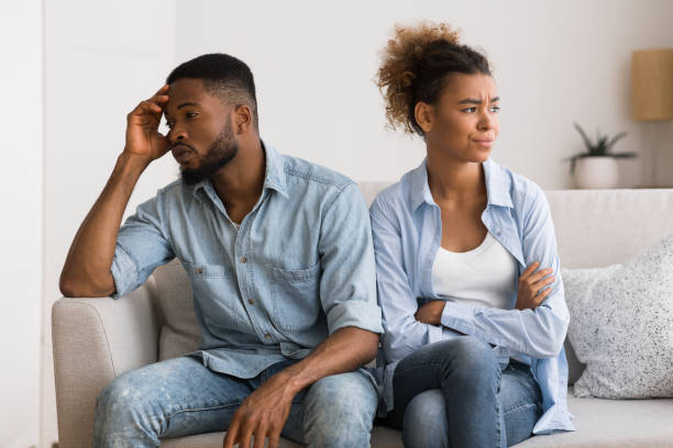 istock Upset Black Couple Avoiding Eye Contact Sitting On Couch 1167725524