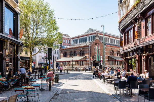 The halles Saint-Gery in the historic center of Brussels, Belgium. Brussels, Belgium - April 20, 2019: The halles Saint-Gery is a former covered market, built in 1882 in the historic center of Brussels, which houses exhibitions since 1999. brick cafe stock pictures, royalty-free photos & images