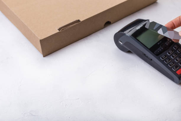 istock Using payment terminal with contactless credit card, cashless paying for pizza in restaurant 1167732612