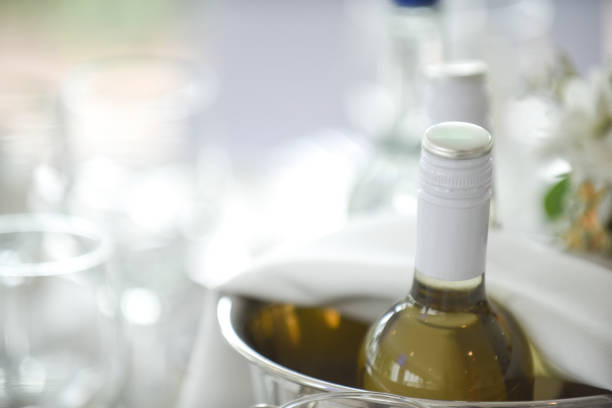 istock Wine bottles in an ice bucket on the restaurant table, white wine 1167735210