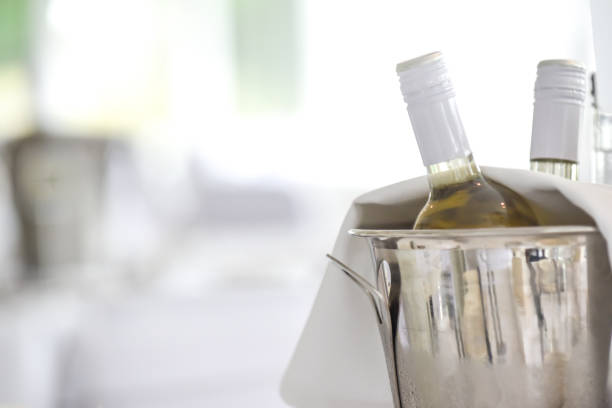 istock Wine bottles in an ice bucket on the restaurant table, white wine 1167735235