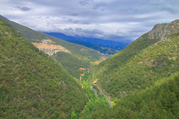 The photo was taken by the mountains of Turkey near the city of Alanya. The picture shows a storm gathering over a narrow valley.