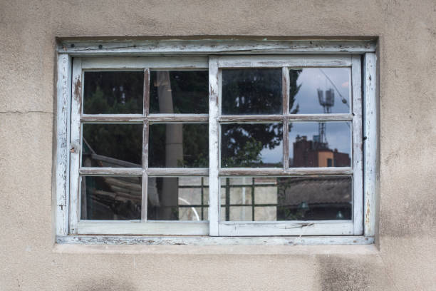 istock Dark room building with window case. Dark inside concrete wall windows 1167736775