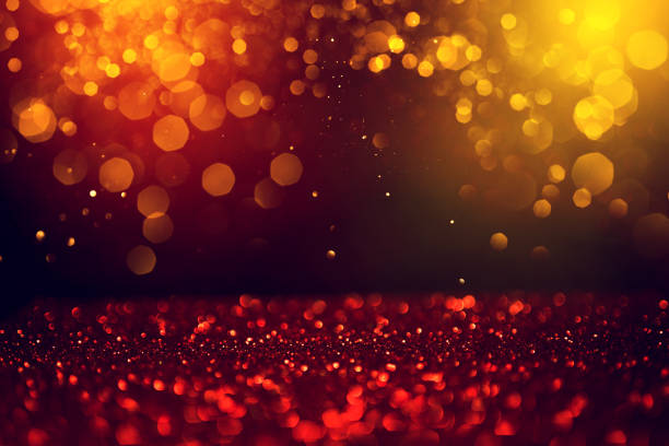 istock Golden abstract bokeh on black background. 1167737048