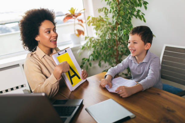 istock Shot of a speech therapist during a session with a little boy 1167737055