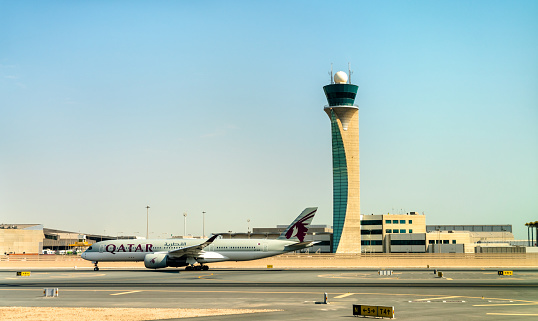Doha, Qatar - July 15, 2019: Airbus A350-941 of Qatar Airways at Hamad International Airport. The airport opened on 30 April 2014 and now accomodates over 35 million passengers per year