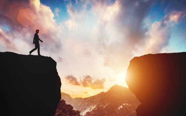 istock Man about to walk on the other side of mountain 1167743210