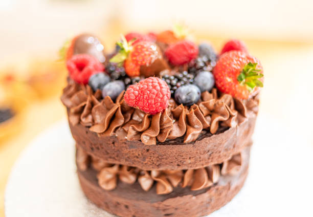 istock Home made chocolate cake with berry fruit 1167744034