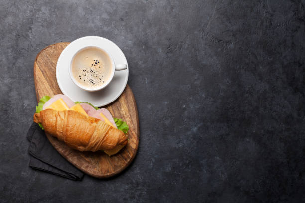 istock Coffee and croissant sandwich 1167745361