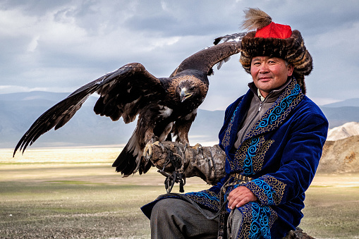 Eagle Hunter with his golden eagle in Bayan-Olgiy, West Mongolia.