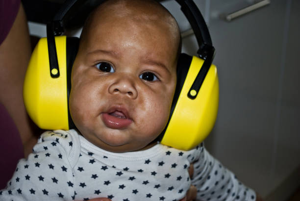 istock Chubby child wear a yellow earmuff 1167748264
