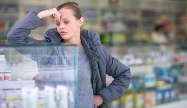 istock Young woman looking for the right pills 1167748292
