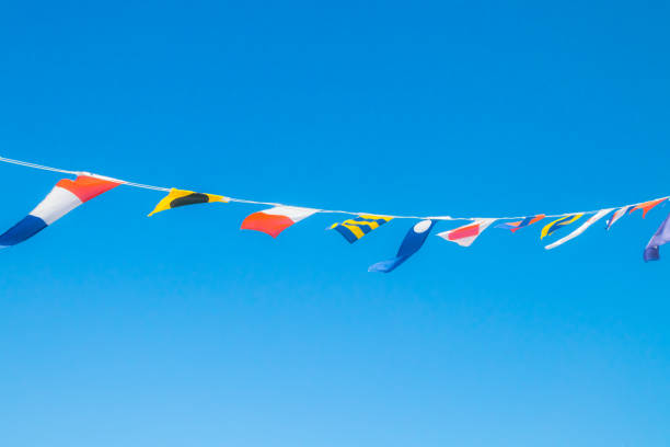 istock Nautical flags on the ship against blue sky 1167748369