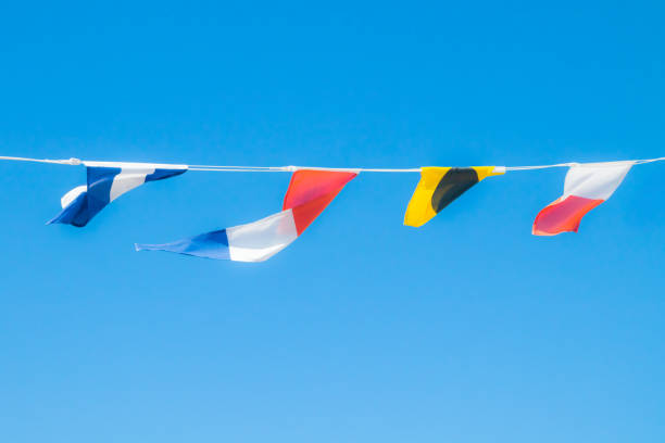 istock Nautical flags on the ship against blue sky 1167748595