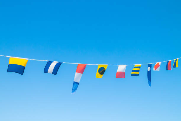 istock Nautical flags on the ship against blue sky 1167749069