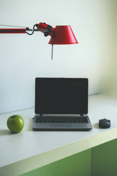 istock Personal computer standing on the table in a hotel room. 1167751097