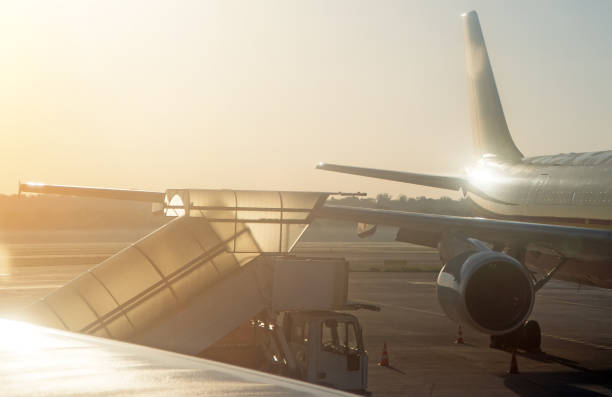istock Part of airplane on the runway at sunset. 1167751699