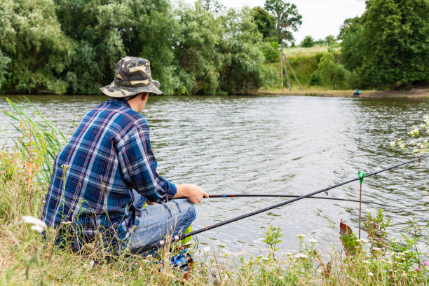 istock Fisherman fishes on the lake 1167752461