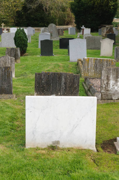 istock Gravestones in a graveyard. No names or inscriptions shown. 1167752553