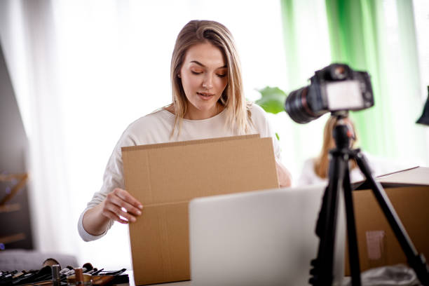 istock Young female influencer doing a live stream for her audience 1167753148