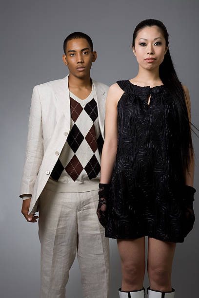 Young couple in conflict on city street  Stylish fashion man and woman