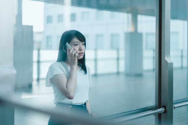 istock Talking on the smartphone through the glass 1167753265