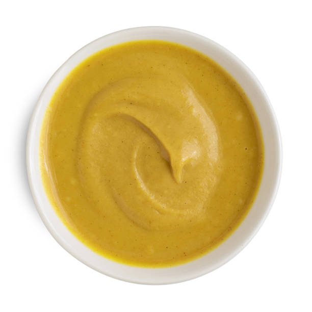 istock Mustard sauce in white ceramic bowl isolated on white background. Top view 1167754720