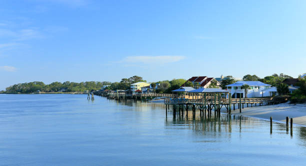 istock Wooden docks and homes along a creek 1167760701